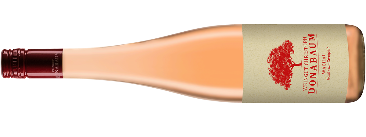 Liegende rosa Weinflasche mit beigem Etikett und rotem Logo darauf Rose vom Zweigelt