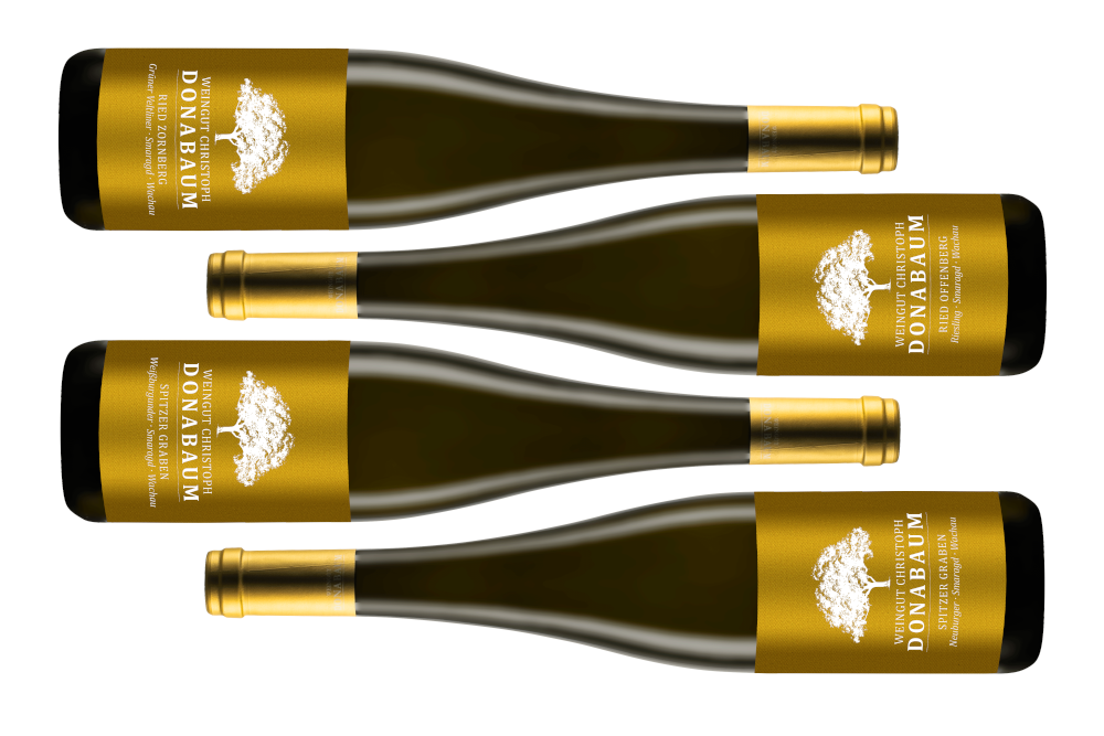 4 wine bottles with golden labels neatly lined up on the side